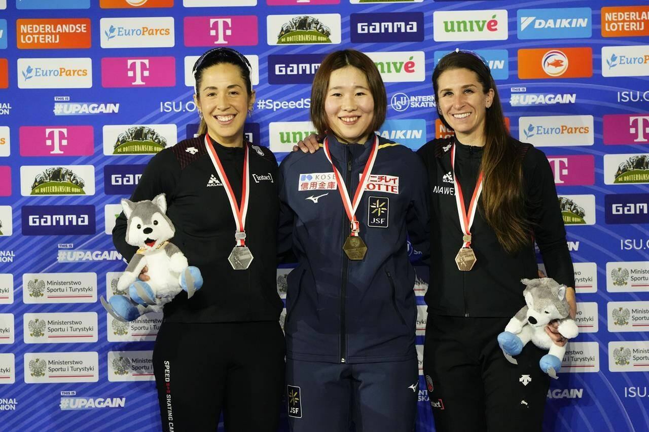 From left, second placed Canada’s Valérie Maltais, first placed Japan’s Momoka Horikawa and third placed Canada’s Ivanie Blondin celebrates at the end of the Mass Start Final Women event of the World Cup Speed Skating in Tomaszow Mazowiecki, Poland, Sunday, Feb. 19, 2023. THE CANADIAN PRESS/AP/Piotr Hawałej