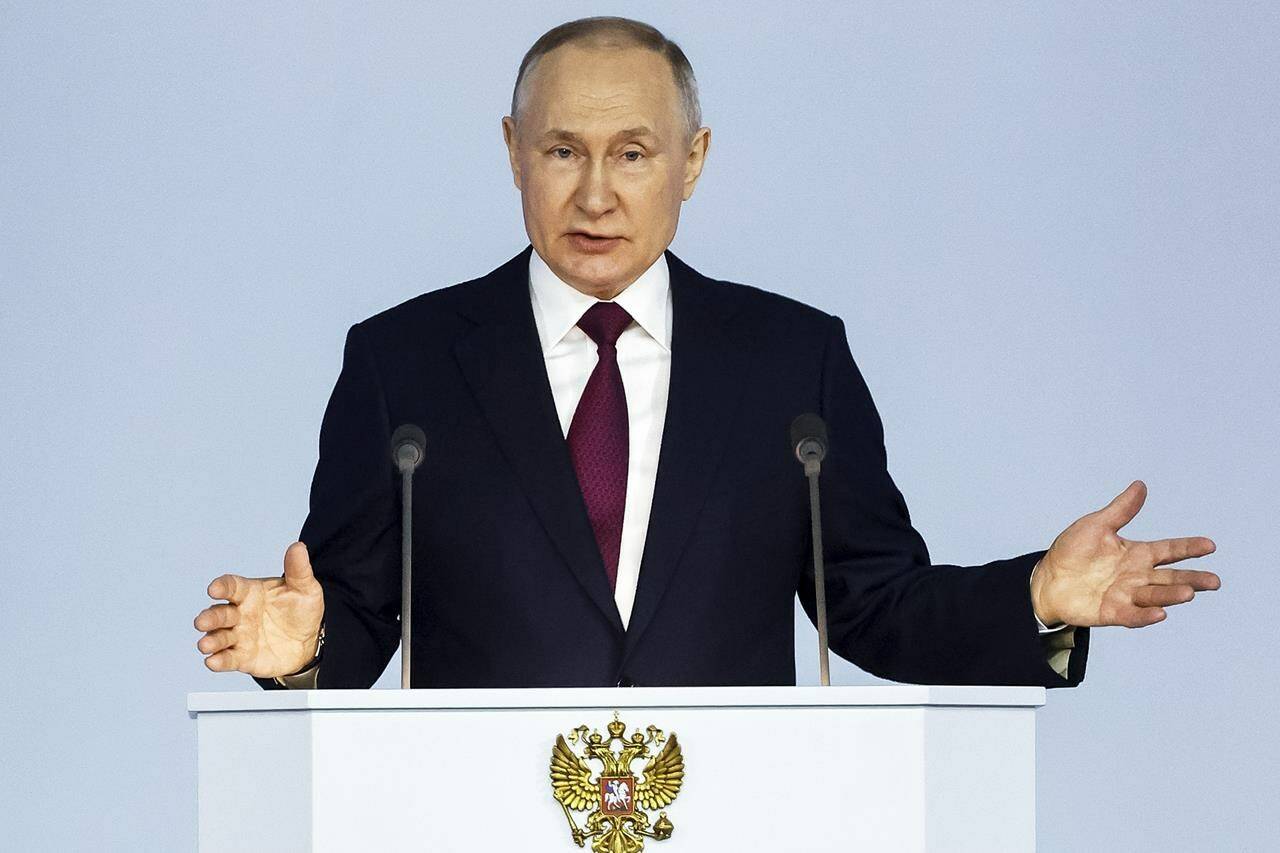 Russian President Vladimir Putin gestures as he gives his annual state of the nation address in Moscow, Russia, Tuesday, Feb. 21, 2023. (Dmitry Astakhov, Sputnik, Kremlin Pool Photo via AP)