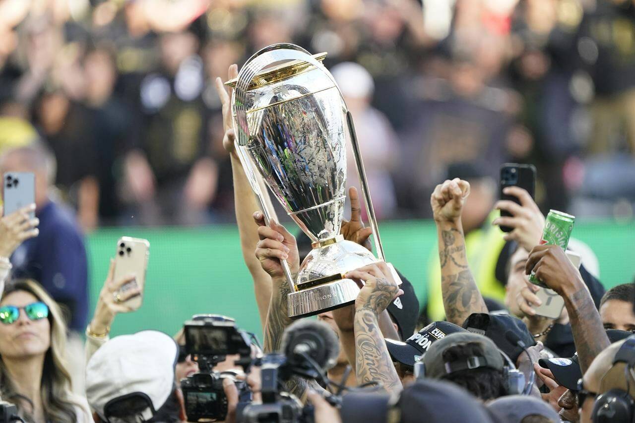 Major League Soccer has expanded its playoff format with two extra teams from each conference making the playoffs and an expanded first round featuring best-of-three series. Los Angeles FC players hoist the trophy after defeating the Philadelphia Union to win the MLS Cup soccer match Saturday, Nov. 5, 2022, in Los Angeles. THE CANADIAN PRESS/AP-Marcio Jose Sanchez