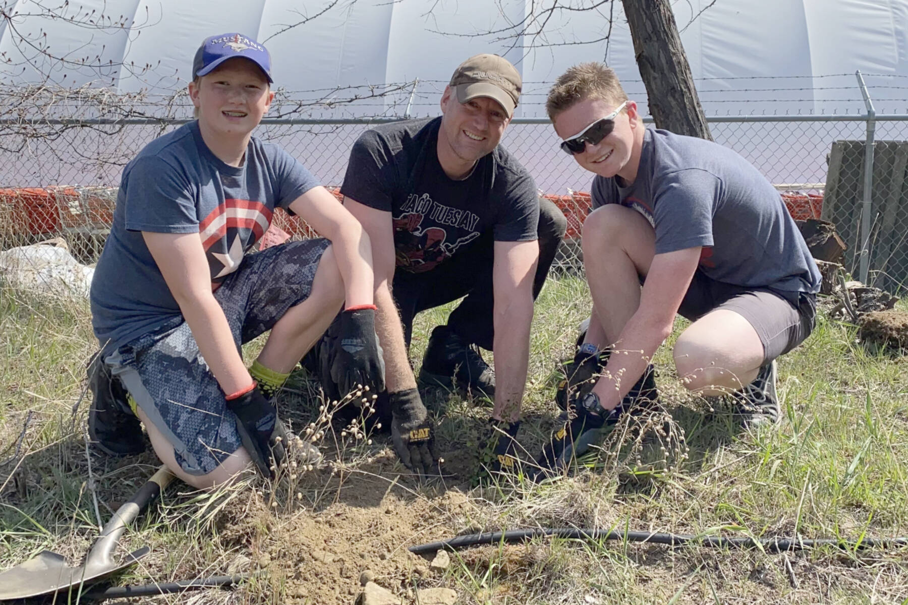 From left Adam Weston, 13, Mark Weston and Carson Weston, 15 were among those who participated in an Earth Week planting event at the Summerland Wastewater Treatment Plant on Sunday, April 24. The planting was one of numerous Earth Week events in Summerland. (John Arendt - Summerland Review)