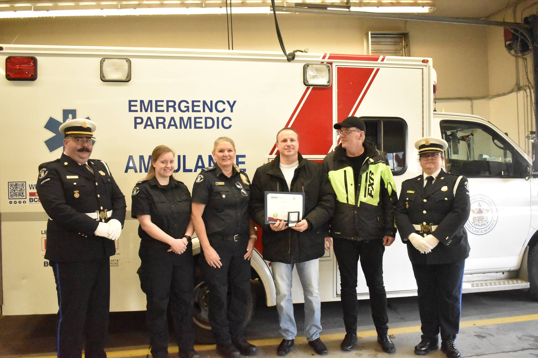 Sinisa Marovic, third from right, saved the life of his neighbour Sinisa Zakosek, second from right, in May 2021 through the use of CPR. He was presented on Friday, Feb. 24, with the Vital Link Award from BCHES.