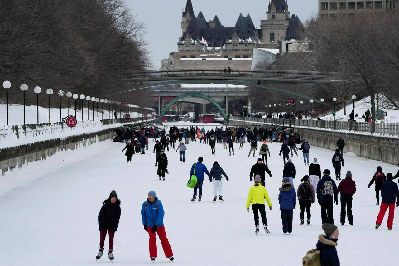 People skate on the Rideau Canal Skateway on Saturday, March 5, 2022. THE CANADIAN PRESS/Justin Tang