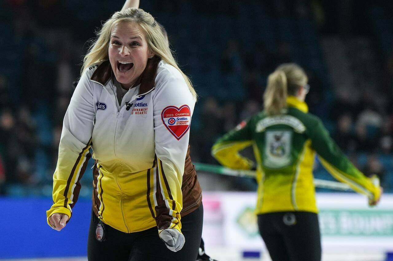 Manitoba skip Jennifer Jones celebrates after defeating Northern Ontario skip Krista McCarville, back right, in a playoff match to reach the final at the Scotties Tournament of Hearts, in Kamloops, B.C., on Saturday, February 25, 2023. THE CANADIAN PRESS/Darryl Dyck