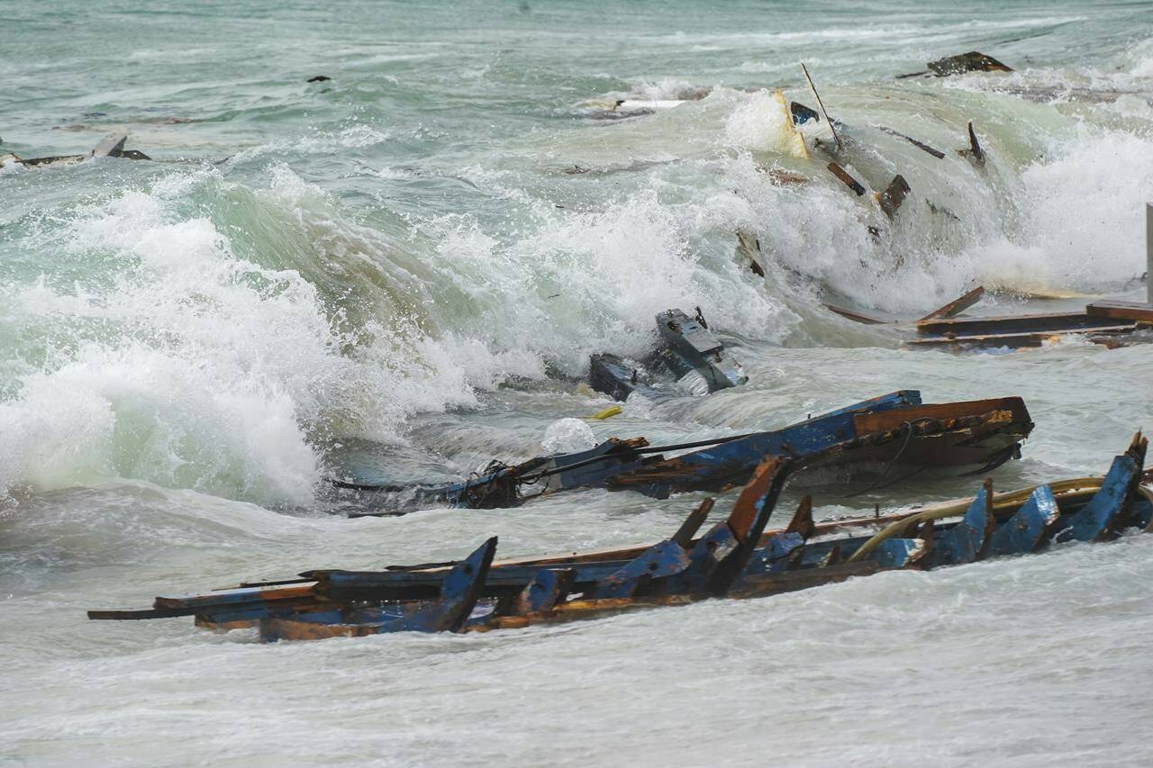 The wreckage from a capsized boat washes ashore at a beach near Cutro, southern Italy, Sunday, Feb. 26, 2023. Rescue officials say an undetermined number of migrants have died and dozens have been rescued after their boat broke apart off southern Italy. (Antonino Durso/LaPresse via AP)