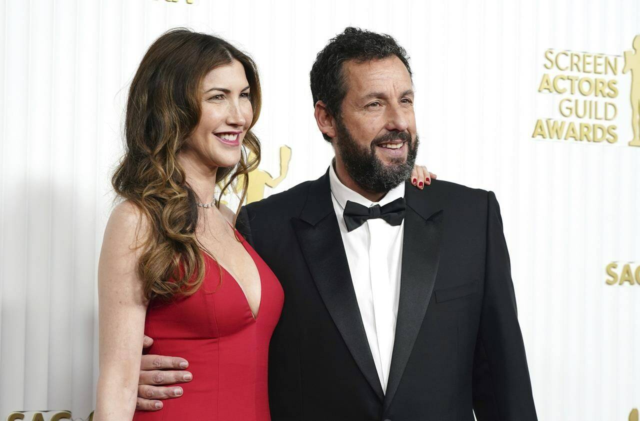 Jackie Sandler, left, and Adam Sandler arrive at the 29th annual Screen Actors Guild Awards on Sunday, Feb. 26, 2023, at the Fairmont Century Plaza in Los Angeles. (Photo by Jordan Strauss/Invision/AP)