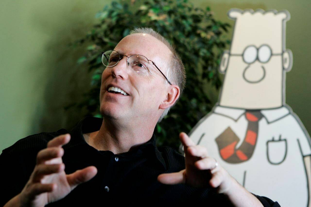 FILE - Scott Adams, creator of the comic strip Dilbert, talks about his work at his studio in Dublin, Calif., on Oct. 26, 2006. Adams experienced possibly the biggest repercussion of his recent comments about race when distributor Andrews McMeel Universal announced Sunday, Feb. 26 it would no longer work with the cartoonist. In an episode of his YouTube show last week, Adams described people who are Black as members of “a hate group” from which white people should “get away.” Various media publishers across the U.S. denounced the comments while saying they would no longer provide a platform for his work. (AP Photo/Marcio Jose Sanchez, File)