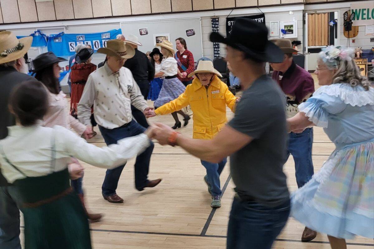 Helen Sidney, the 100-year-old Citizen of the Year, (yellow jacket) is seen dancing at the Vernon Star Country Square Dance recent open house. (Contributed)