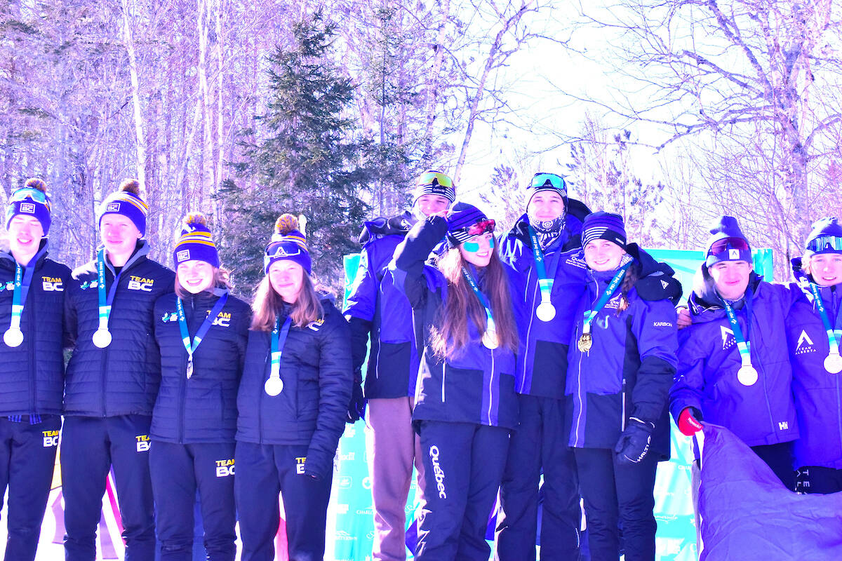 Vernon’s Parker Munroe (second from left) celebrates a silver medal with his B.C. teammates in biathlon’s mixed relay event at the Canada Winter Games in Prince Edward Island (Paul R Mcguire Photo)