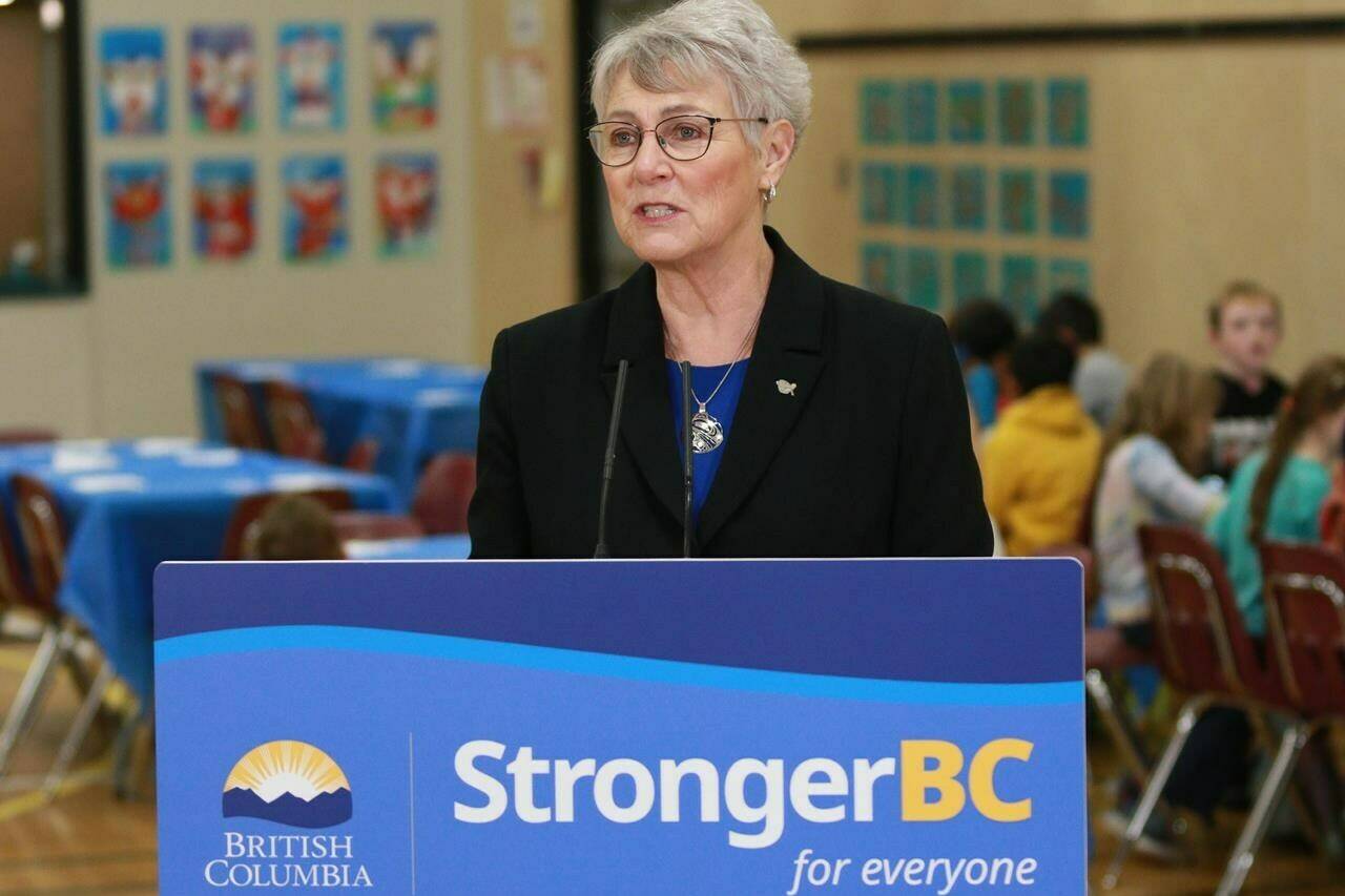 B.C. Finance Minister Katrine Conroy speaks during a news conference as students enjoy a hot lunch at Ruth King Elementary in Langford, B.C., Monday, Feb. 27, 2023. (Chad Hipolito/Canadian Press)