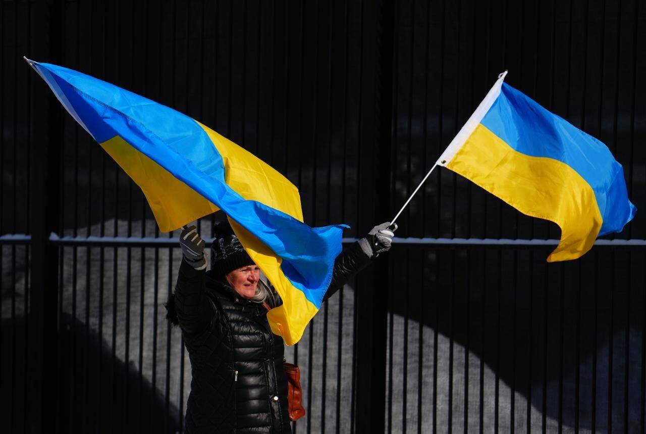People demonstrate against the war in the Ukraine in front of the Russian embassy in Ottawa on Friday, Feb. 24, 2023. The war in Ukraine is now in its second year. THE CANADIAN PRESS/Sean Kilpatrick
