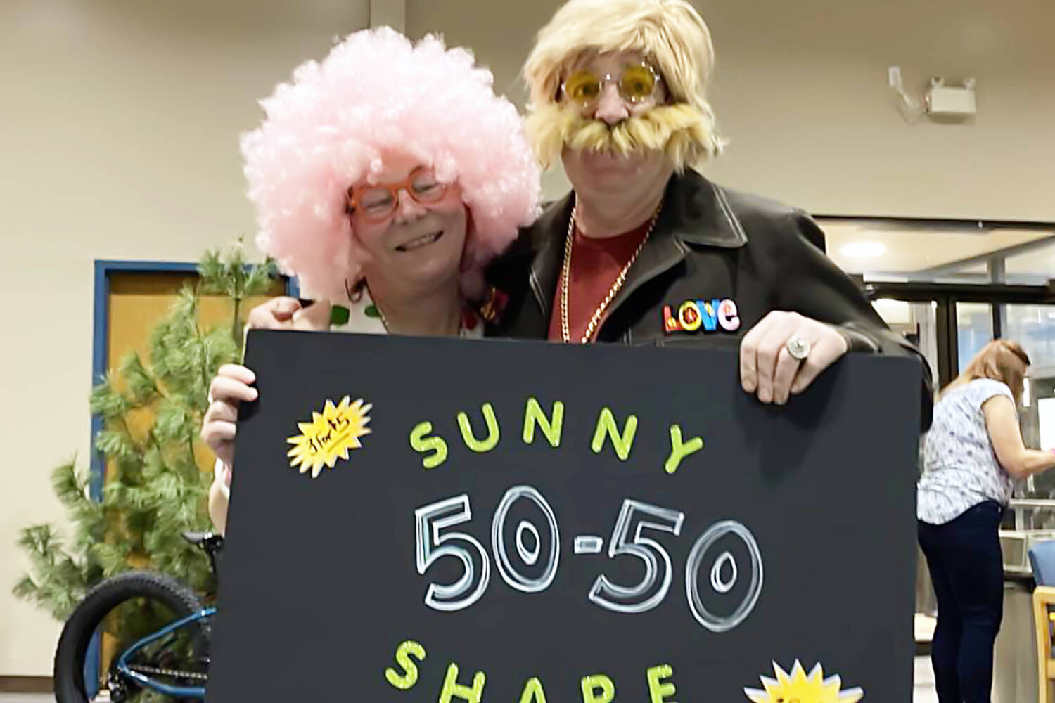 City of Salmon Arm Couns. Louise Wallace Richmond and Kevin Flynn lend a hand with the Shuswap Trail Alliance’s fundraising efforts during the Trails Party at the SASCU Recreation Centre on Friday, Feb. 3, 2023. (Barb Brouwer/Facebook photo)