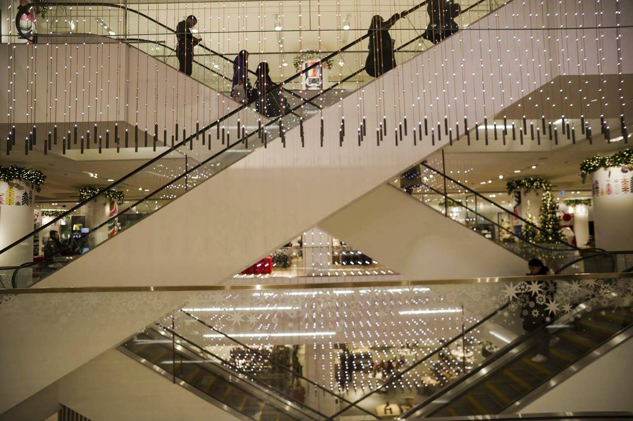 Shoppers take the escalators looking for Boxing Day deals at a Nordstrom store in downtown Toronto on Monday, December 26, 2017. Nordstrom’s forthcoming summer departure from Canada’s retail landscape will leave massive holes in malls that some analysts say landlords will have to get creative to fill. THE CANADIAN PRESS/Christopher Katsarov
