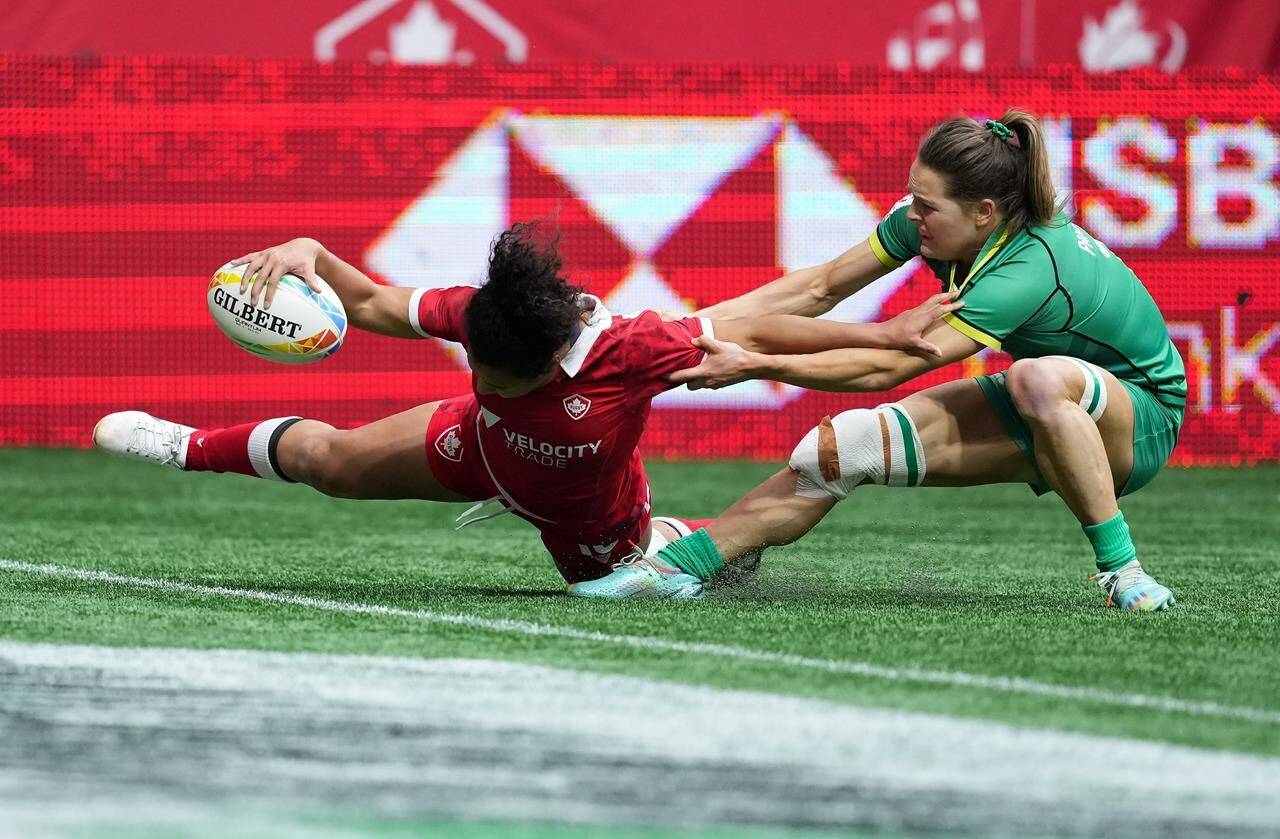 Canada’s Fancy Bermudez, left, scores her second try past Ireland’s Beibhinn Parsons during HSBC Canada Sevens women’s rugby action, in Vancouver, B.C., Sunday, March 5, 2023. Bermudez scored a pair of tries as the Canadian women defeated Ireland 24-12 Sunday to put themselves in position for there best result this season at the HSBC Canada Sevens Tournament. THE CANADIAN PRESS/Darryl Dyck