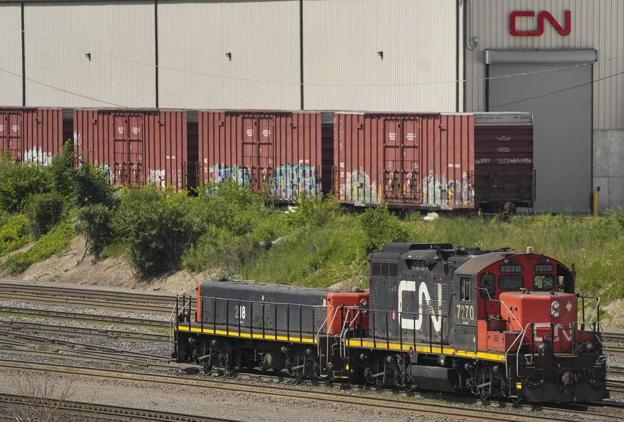CN rail trains are shown at a train yard in Vaughan, Ont., on Monday, June 20, 2022. CN workers have backed a strike vote with negotiations set to resume on a contract for around 3,000 Canadian employees.THE CANADIAN PRESS/Nathan Denette