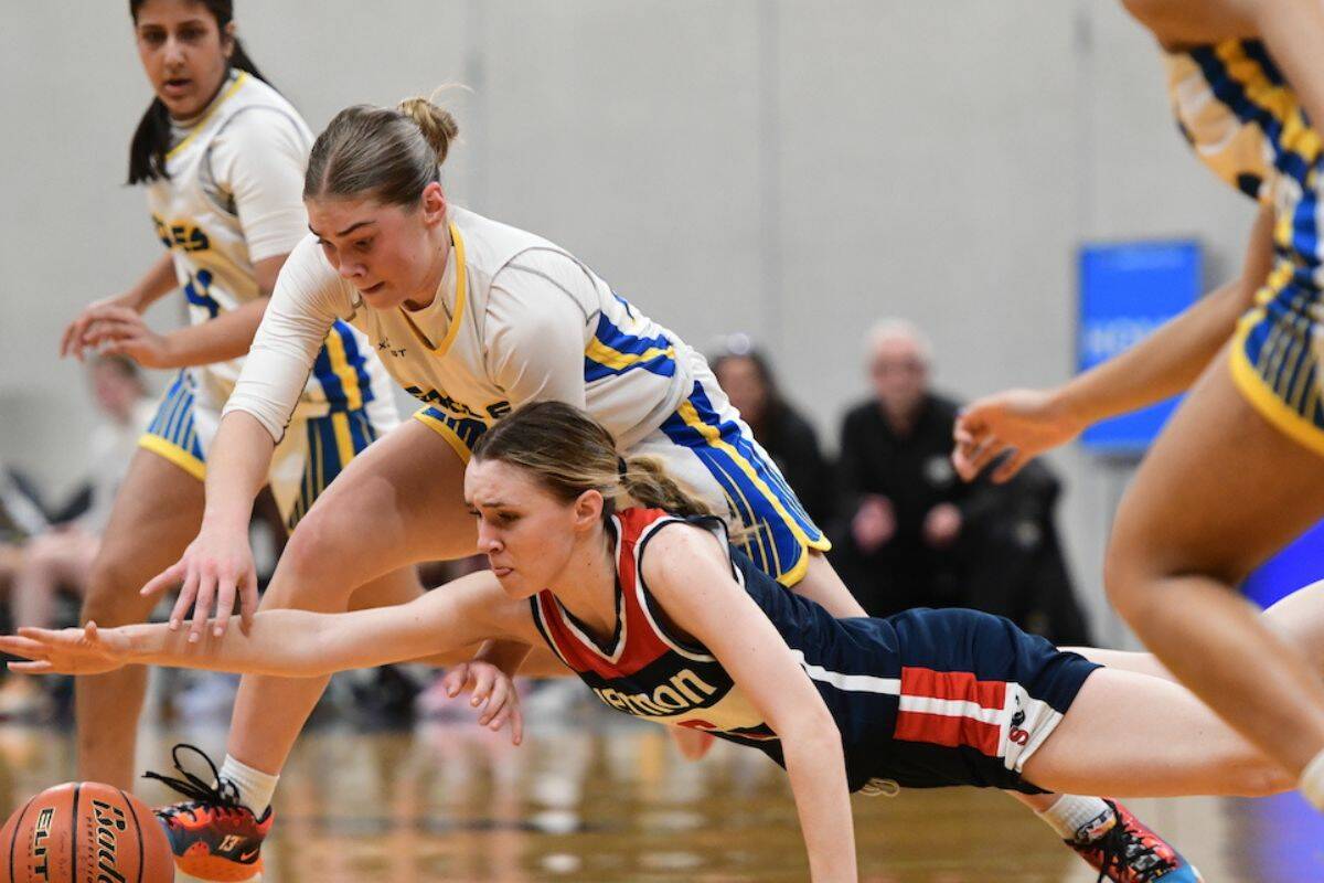 Vernon’s Beth Butler dives for a loose ball, with MEI Eagles Bree Neufeld in pursuit. The Panthers would lose to the Eagles in day one action from the Langley Events Centre at the 2023 B.C. High School Girls Provincial Basketball Championship. (Varsity Letters)