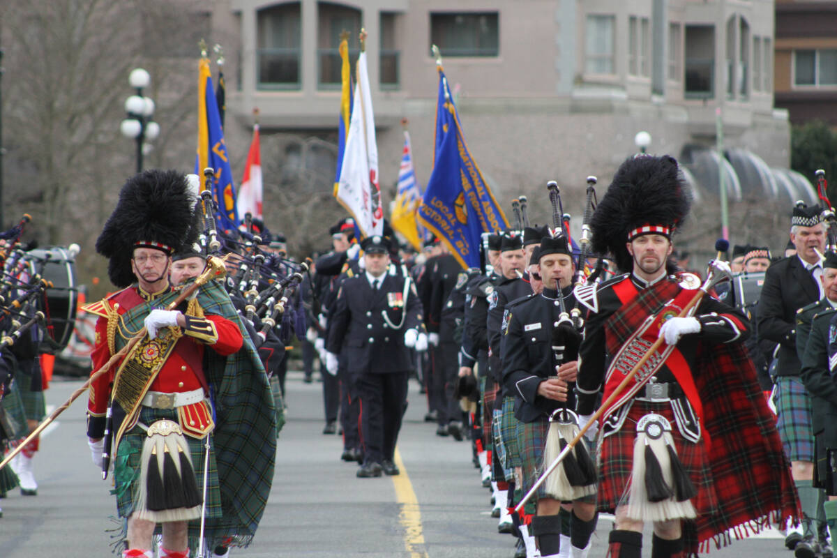 Bagpipers lead a procession of B.C. firefighters down Belleville Street towards the south lawn of the legislature in Victoria Monday (March 6). (Austin Westphal/News Staff)