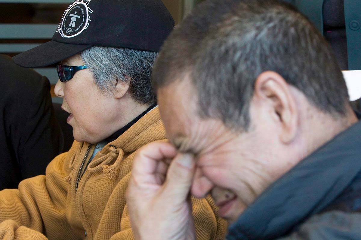 Murder victim Amanda Zhao’s mother Baoying Yang (left) and father Zisheng Zhao pause for a moment during a news conference in Vancouver, Monday, Oct. 20, 2008. Fifteen years later, the family is calling for action after learning their daughter’s killer is seeking refugee status in New Zealand. THE CANADIAN PRESS/Jonathan Hayward