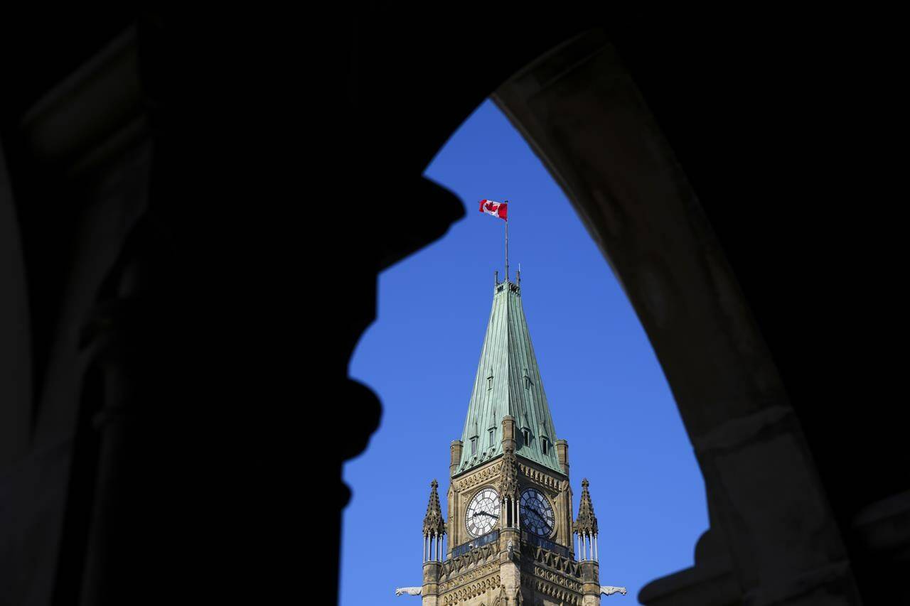 The Canadian flag flies on top of the Peace Tower on Parliament Hill in Ottawa on Monday, March 6, 2023. People who have been convicted of a number of indecency and anti-abortion offences that are no longer on the books can now apply to have those convictions expunged.THE CANADIAN PRESS/Sean Kilpatrick