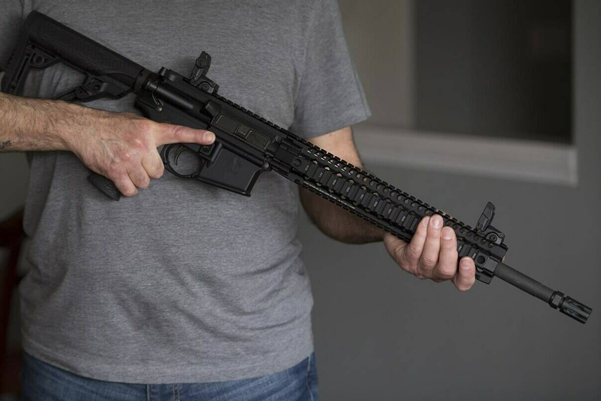 A restricted gun licence holder holds an AR-15 at his home in Langley, B.C. Friday, May 1, 2020. A House of Commons committee studying federal efforts to outlaw assault-style firearms is hearing criticism, as well as some measured support, from Indigenous leaders. THE CANADIAN PRESS/Jonathan Hayward