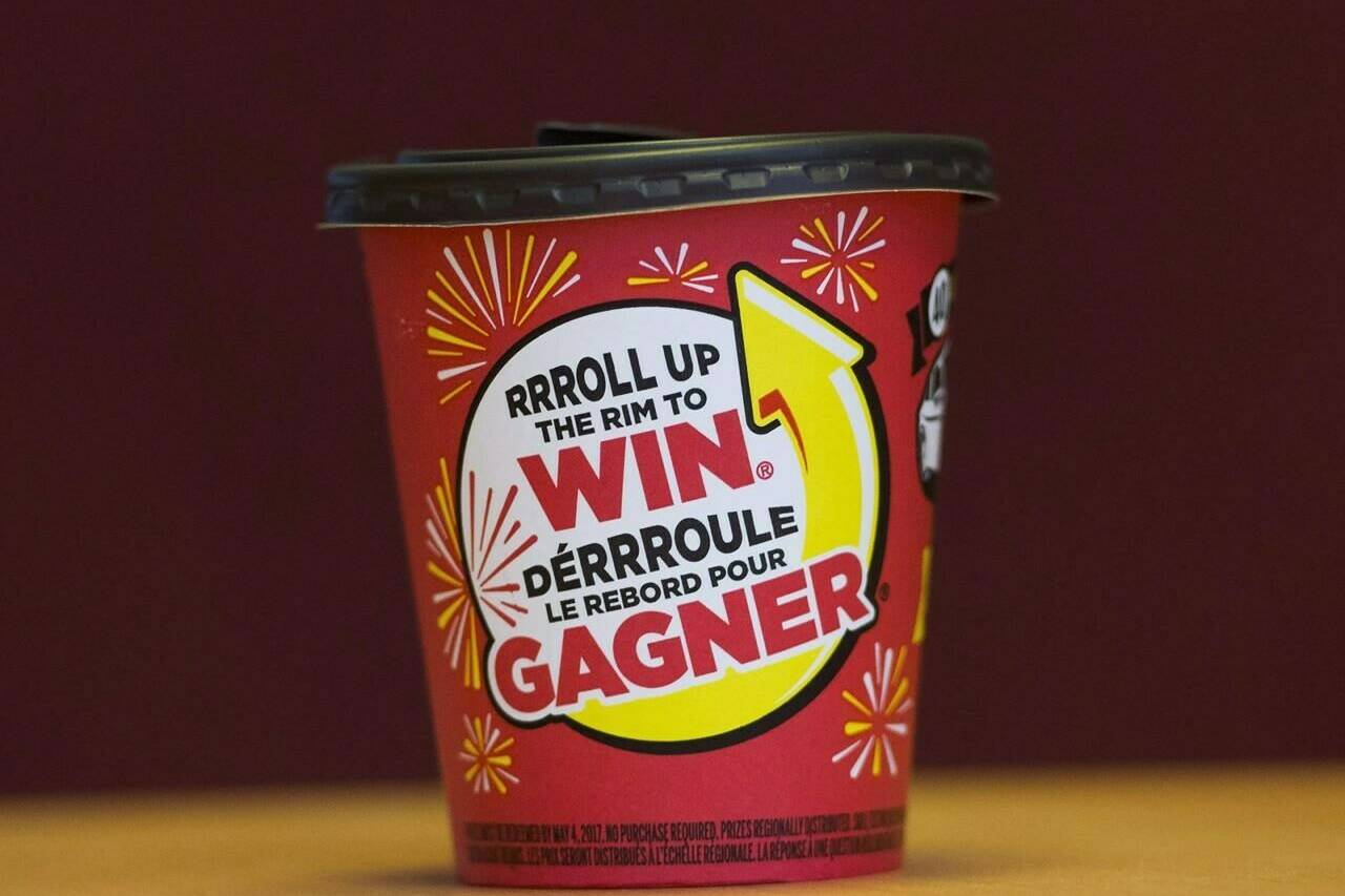 A Tim Hortons cup is shown in Toronto on Thursday, February 3, 2017. Tim Hortons say a technical error caused some customers using the restaurant’s app to receive an incorrect award message during the first day of its Roll Up To Win contest. THE CANADIAN PRESS/Nathan Denette