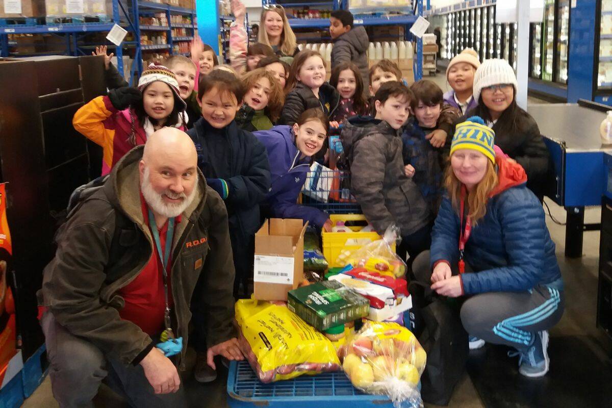 The Grade 2 students from St. James School outside of the Wholesale Grocery store after purchasing items for the Mission Food Bank. (Contributed)