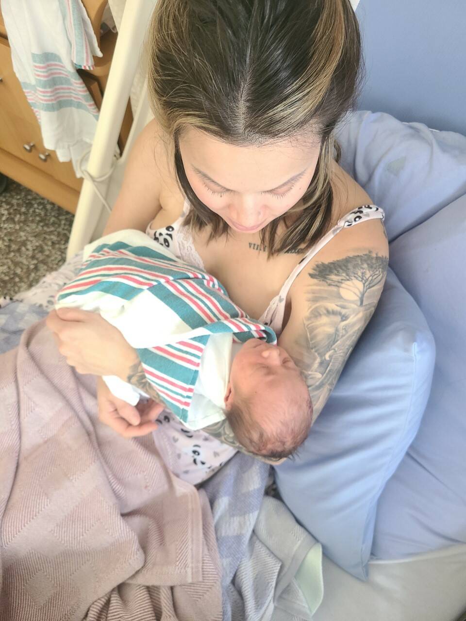 Brittany Lee holds her newborn son born Feb. 28 in a minivan en route to Cariboo Memorial Hospital in Williams Lake. (Photo submitted)
