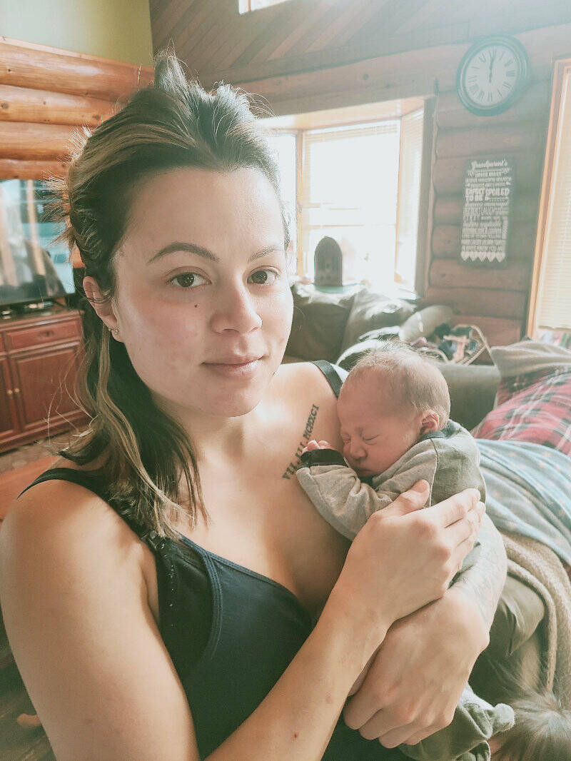 Brittany Lee of Likely, B.C. holds her newborn son, born on Feb. 28 in a minivan en route to the hospital in Williams Lake. (Photo submitted)