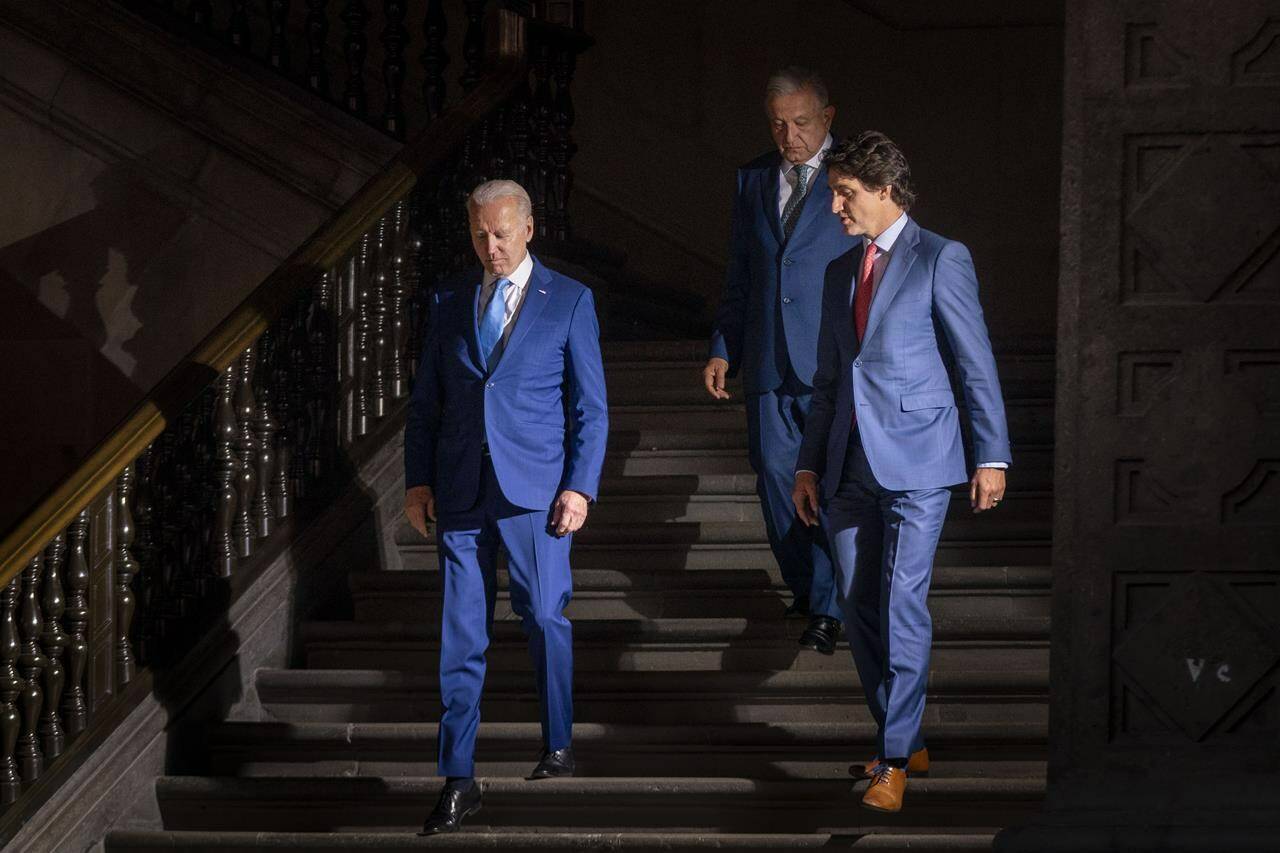 President Joe Biden, left, Prime Minister Justin Trudeau, right and Mexican President Andres Manuel Lopez Obrador, arrive for a news conference in Mexico City, Tuesday, Jan. 10, 2023. Biden will travel to Ottawa on March 23 for two days in Canada, his first visit in person since taking office in 2021. THE CANADIAN PRESS/AP-Andrew Harnik