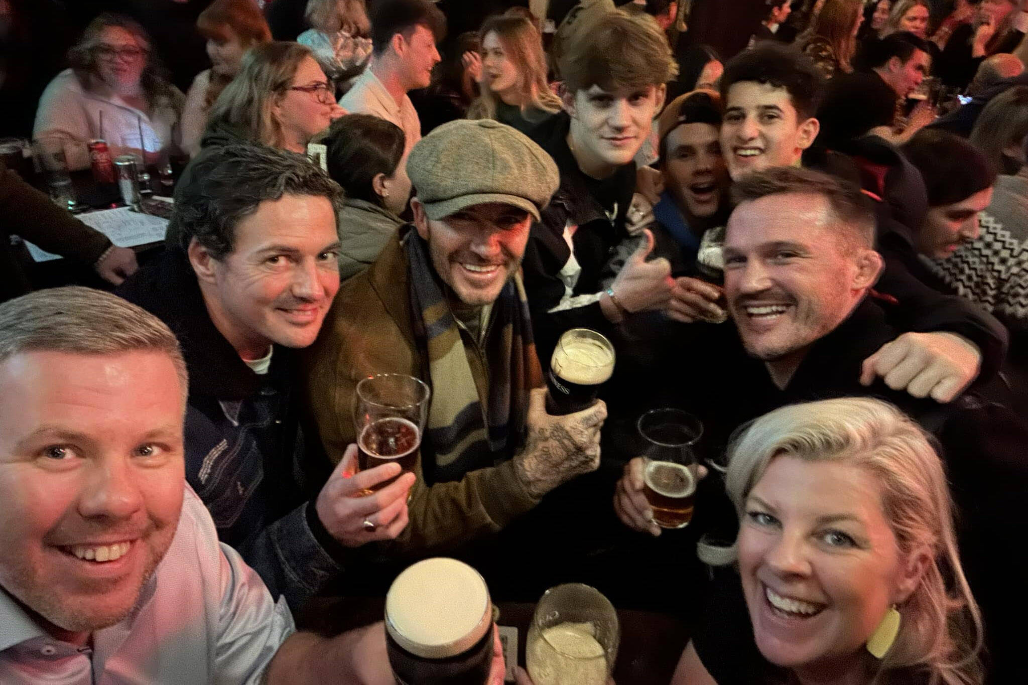 Two North Shore business owners, Trish Neufeld and her brother David Smyth (at bottom, right and left), were given a night to remember when they bumped into David Beckham and his son at a pub in Dublin. (David Smyth/ Facebook)