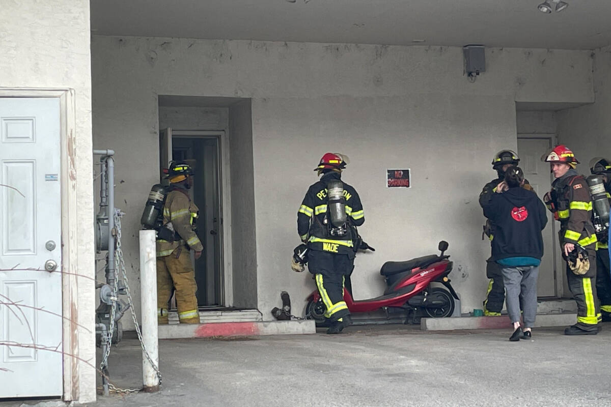 Penticton Firefighters go into a building in the 400 block of Main Street where a storage room had been broken into and a mattress was on fire on March 8. The building houses residents, a coffee house and Twisted Chopsticks Eatery. (Brennan Phillips Western News)