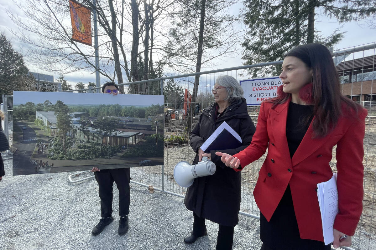 Val Napoleon, acting dean of law, along with Patricia Barkaskas, strategic advisor to the dean for the National Centre for Indigenous Laws, show a rendering of the future building at the University of Victoria Thursday (March 9). (Austin Westphal/News Staff)