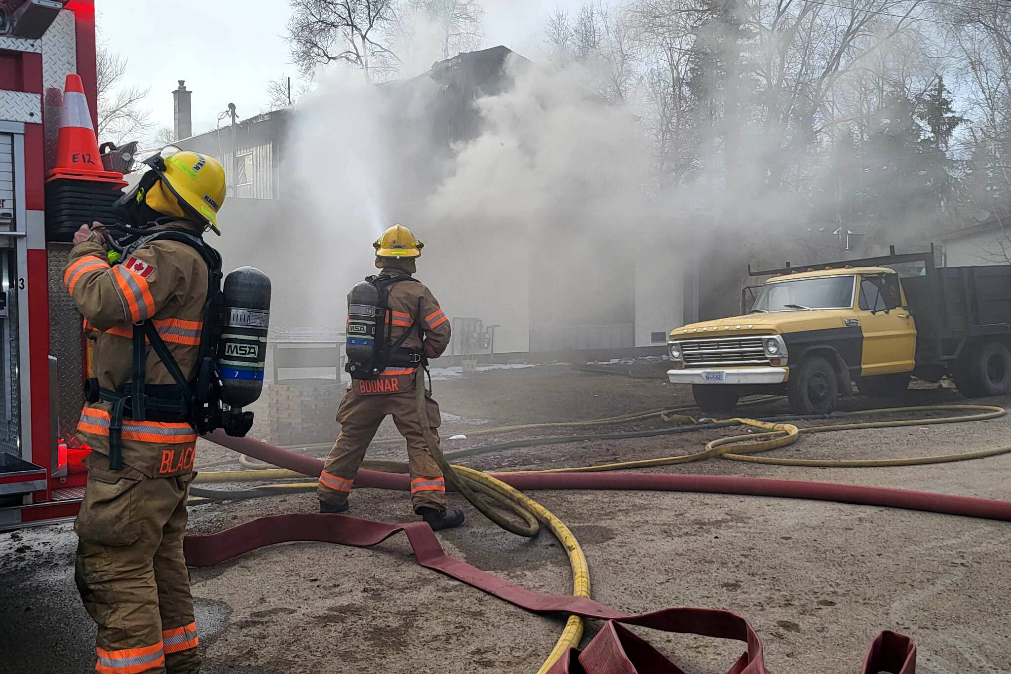 Coldstream firefighters battle a house fire Friday, March 10. (Roger Knox - Morning Star)