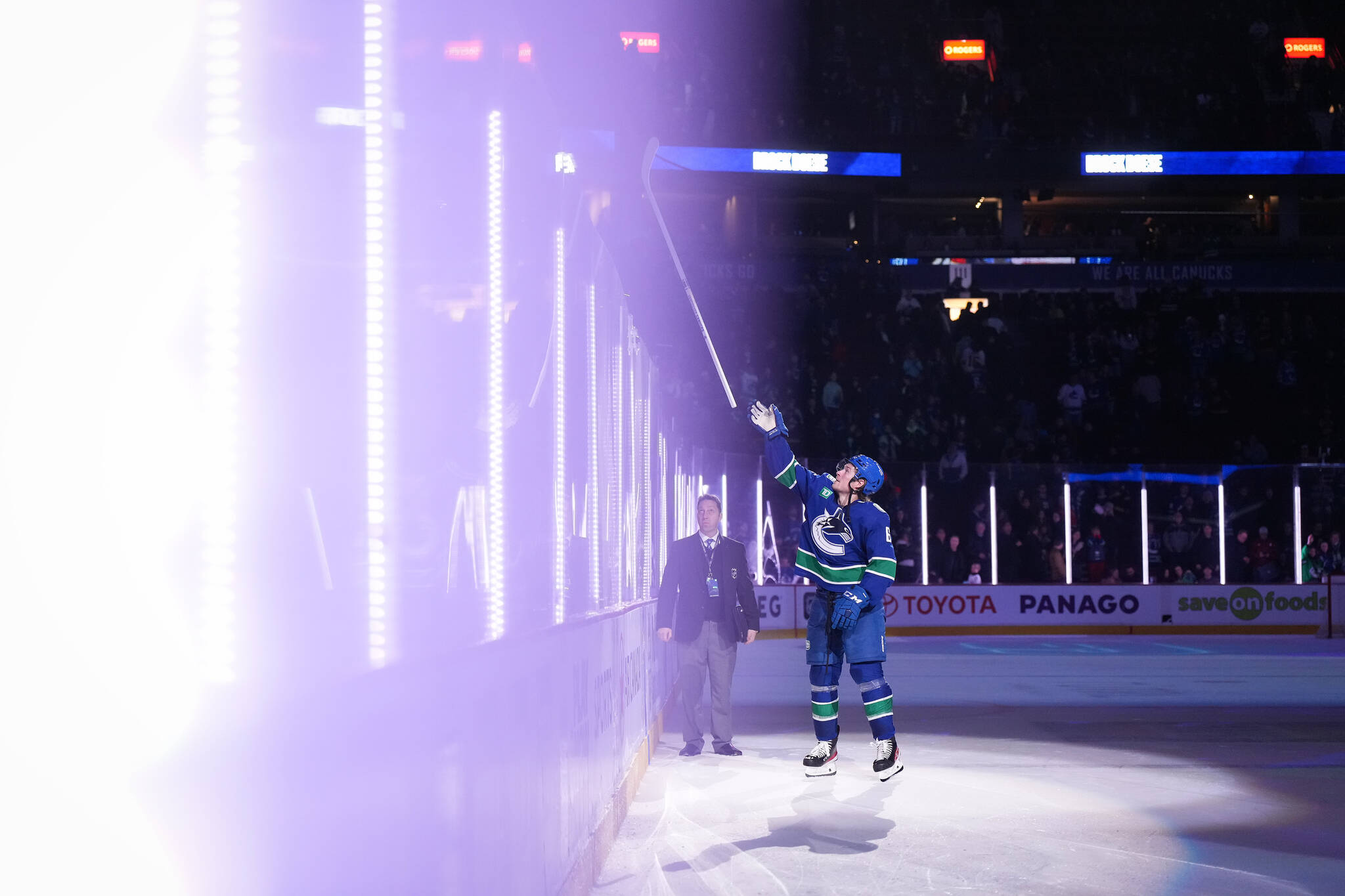 Vancouver Canucks’ Brock Boeser tosses a stick into the crowd after being named the first star of the game after Vancouver defeated the Dallas Stars during an NHL hockey game in Vancouver, on Tuesday, March 14, 2023. THE CANADIAN PRESS/Darryl Dyck