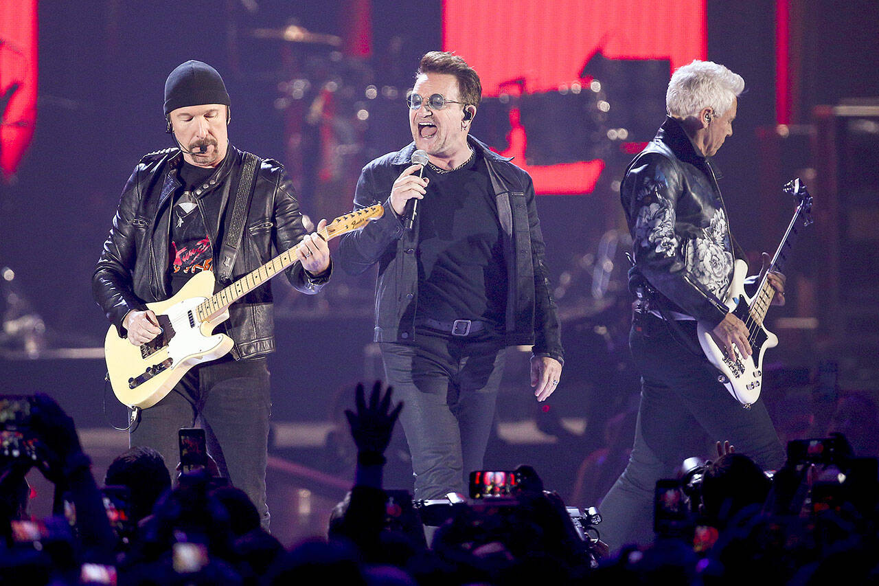 In this Sept. 23, 2016, file photo, The Edge, from left, Bono and Adam Clayton of the music group U2 perform at the 2016 iHeartRadio Music Festival at T-Mobile Arena in Las Vegas. Do you know when this Irish band was formed? (Photo by John Salangsang/Invision/AP, File)