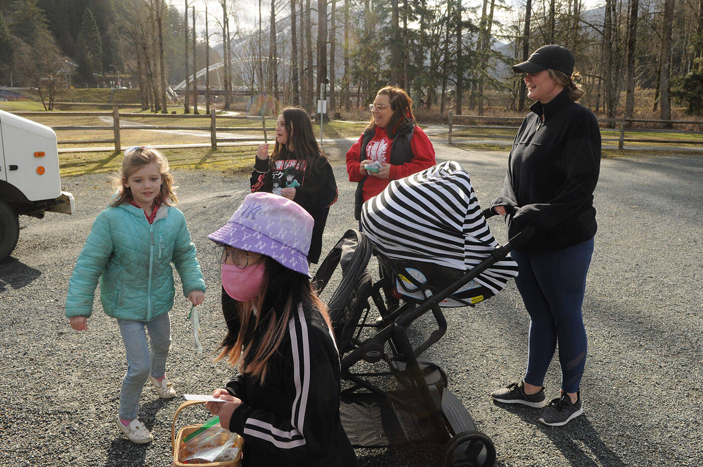 Kids from Watson Elementary prepare to buy a stranger a coffee as teacher Jen Thiessen (red sweatshirt) smiles at Vedder Park during Watson Elementary’s Kindness Project on Wednesday, March 15, 2023. (Jenna Hauck/ Chilliwack Progress)