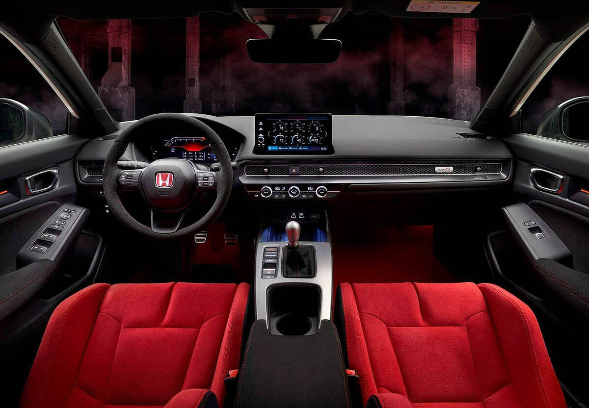 The Civic Type R’s interior gets red seats and carpet and a special page for the display that monitors vehicle performance. Note the standard six-speed manual transmission. PHOTO: HONDA