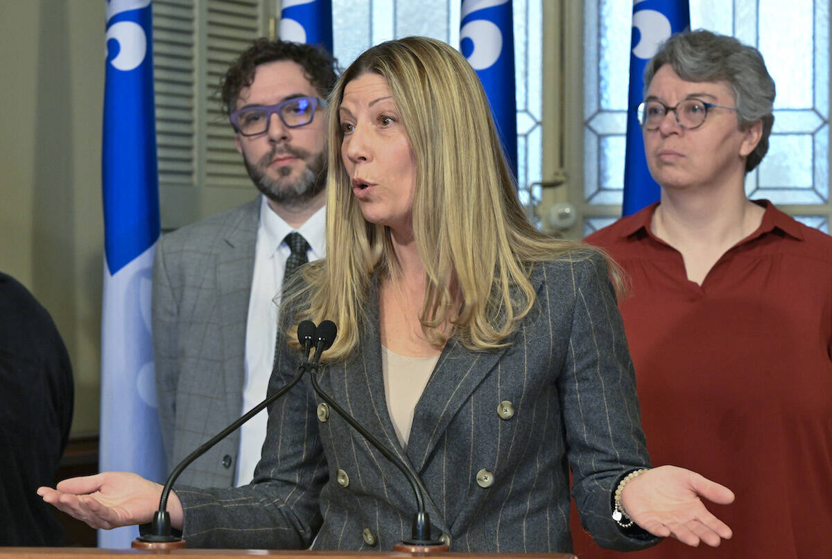 Quebec Liberal MNA Jennifer Maccarone speaks at a news conference on Tuesday, February 21, 2023 at the legislature in Quebec City. Interligne director general Pascal Vaillancourt, left, looks on. THE CANADIAN PRESS/Jacques Boissinot