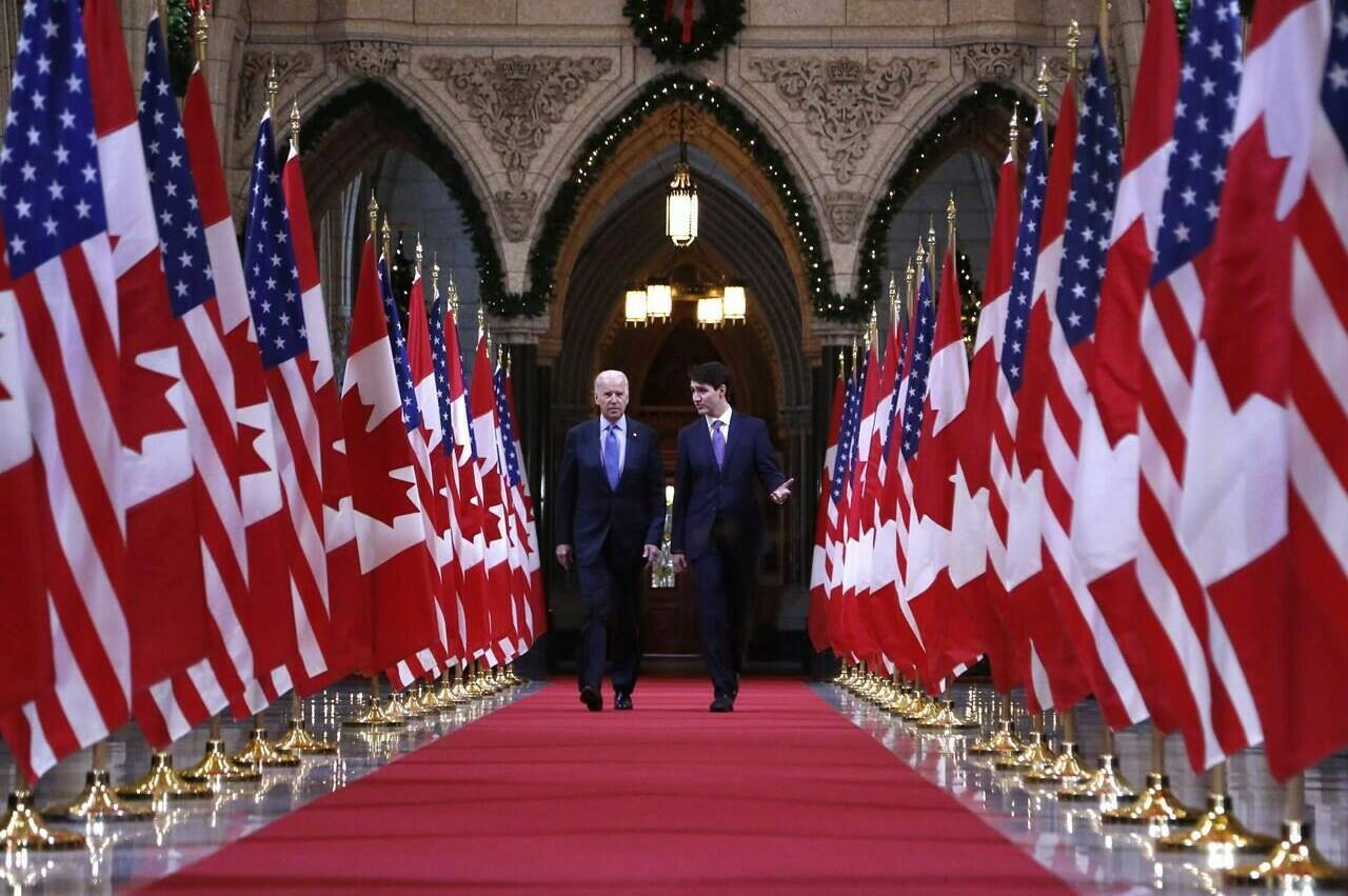 Prime Minister Justin Trudeau and U.S. vice-president Joe Biden walk down the Hall of Honour on Parliament Hill in Ottawa on Friday, December 9, 2016. Biden will once again sit down with Trudeau in Ottawa beginning Thursday, his first official visit to Canada as U.S. president. THE CANADIAN PRESS/Patrick Doyle