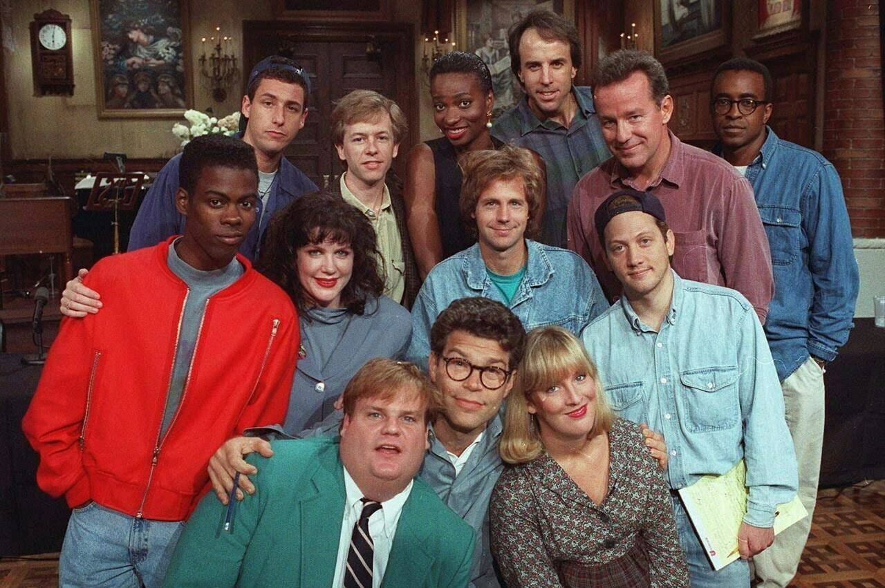 FILE - The cast of NBC’s “Saturday Night Live” pose on the show’s set in New York, Sept. 22, 1992. From left, front row; Chris Farley, Al Franken and Melanie Hutsell. In middle row, from left: Chris Rock, Julia Sweeney, Dana Carvey and Rob Schneider. In back row, from left: Adam Sandler, David Spade, Ellen Cleghorne, Kevin Nealon, Phil Hartman and Tim Meadows. Sandler will be honored by a host of comedic and entertainment royalty Sunday, March 19, 2023, as he receives the Kennedy Center’s Mark Twain Prize for American Humor. (AP Photo/Justin Sutcliffe, File)