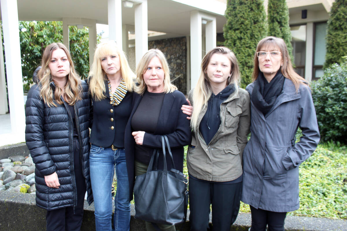 A sombre group after the Colin John decision in the murder of Derek Descoteau. From left: Paula Phillips, Kristina Tkachuk, Brenda Smith, Janelle Guyatt and Leah Guyatt outside the Duncan courthouse. (Photo by Don Bodger)