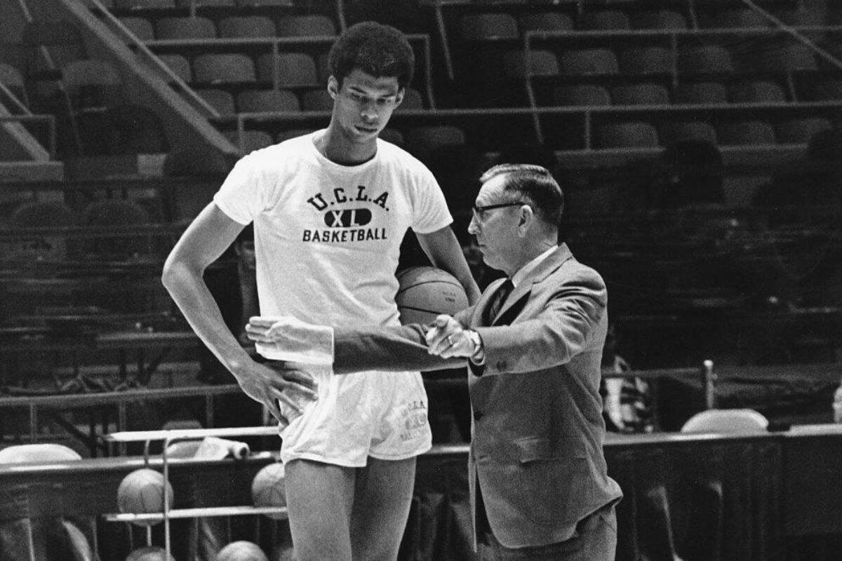 John Wooden, seen here with NBA Hall of Famer Kareem Abdul-Jabbar, coached the UCLA Bruins to a record 10 NCAA Championships. (Leading Beat Photo)