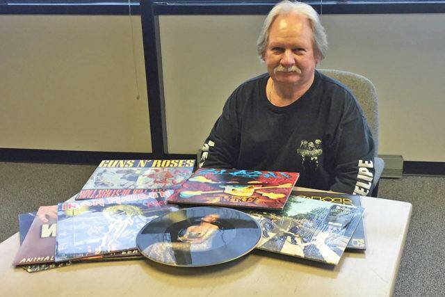 Kelowna resident John Gowland with some of his collection of 9,000 records. (File photo)