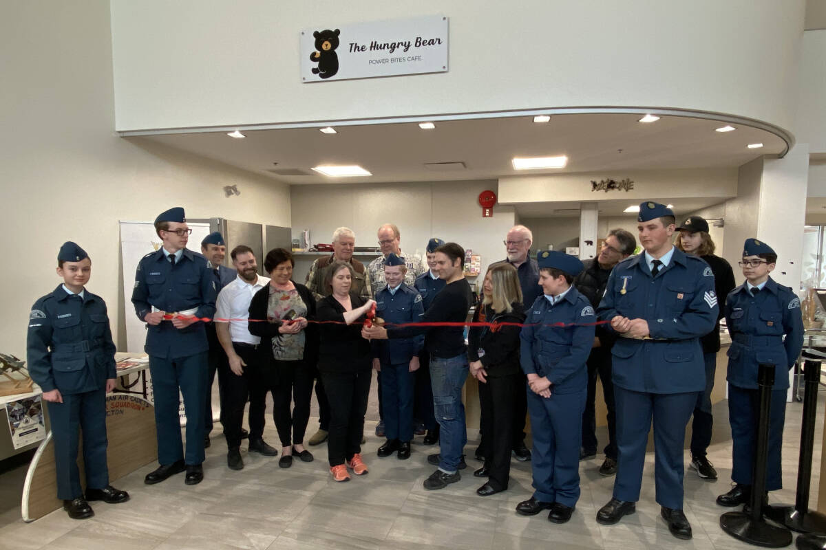 Business owner Christina Teshier cutting the ribbon to mark the opening of Hungry Bear Power Bites Café inside the Penticton Regional Airport. (Logan Lockhart- Western News)